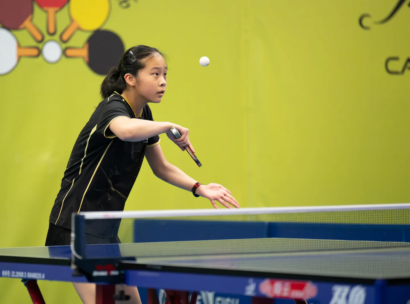 Cindy Zhu focused on the ball during a table tennis match