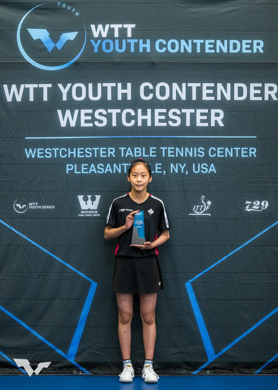 Cindy Zhu holding the trophy she won at WTT Youth Contender Westchester